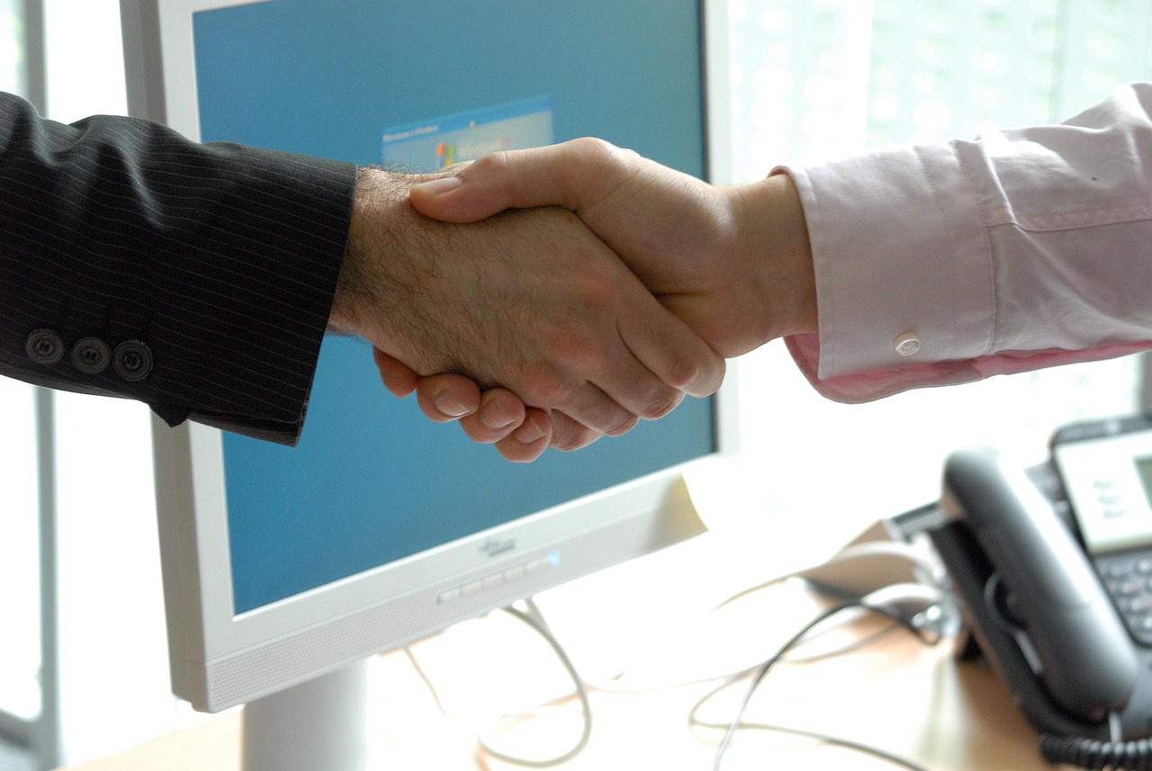 Hand shake, business, professional — Empowering Entrepreneurs: Nihar Gala's Insights and Advice